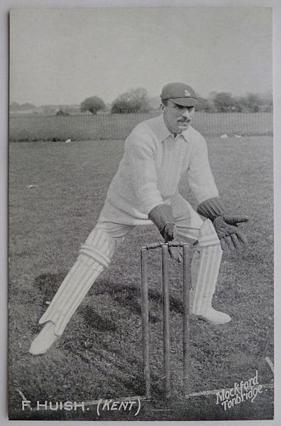 An original full-length postcard photograph of F. Huish keeping wicket.