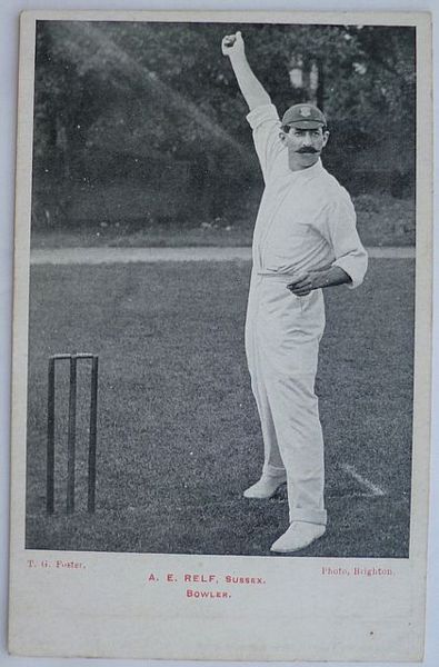 An original full-length postcard photograph of A.E. Relf at the wicket, bowling.