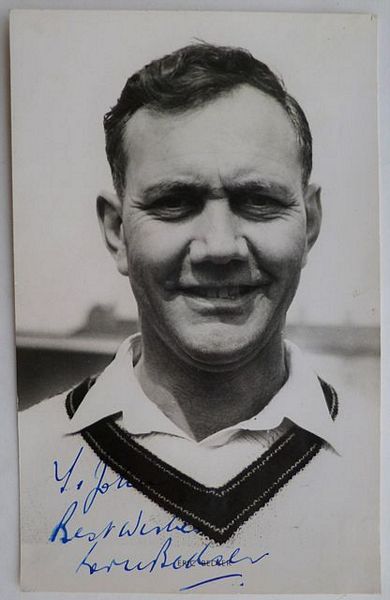 An original half-length postcard photograph of Eric Bedser.