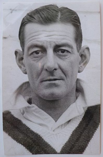 A reproduction head and shoulders postcard-size photograph of the Australian cricketer Ted McDonald.