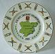 A Coalport china plate decorated with a central design of a county map an0d badge. The outer rim incorporates a design of seventeen county badges with bats and stumps.