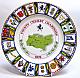 A Coalport china plate decorated with a central design of the county map and badge.  The outer rim incorporates a design of seventeen county badges with bats and balls.