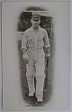 An original full-length postcard photograph of Patsy Hendren walking to the wicket.