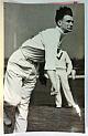 An original full-length postcard-size action photograph of Peter Greenwood bowling.
