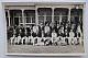 An original postcard photograph of the Australian team which toured England in 1938 and the Leicestershire team, taken during their match at Leicester, 7th - 10th May 1938.